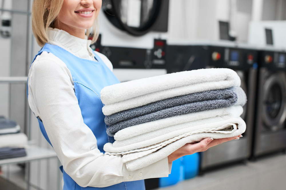 A neatly stacked pile of freshly laundered shirts.